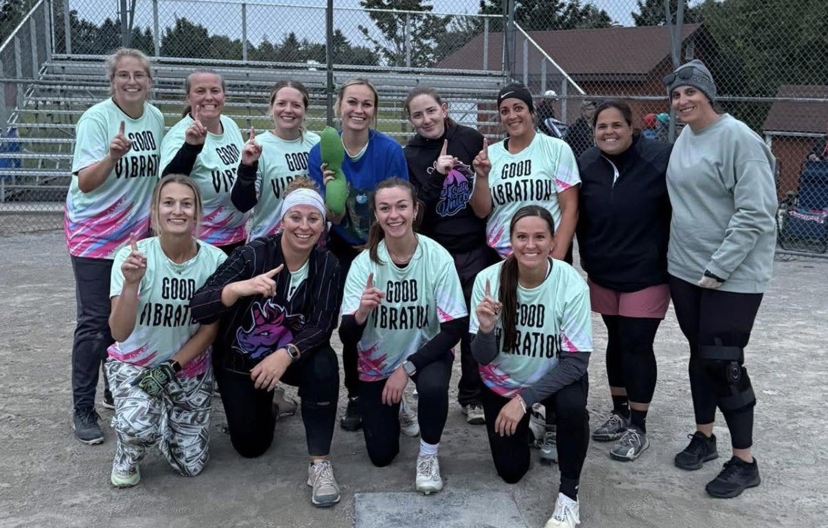 The Good Vibrations team celebrating their championship on the field